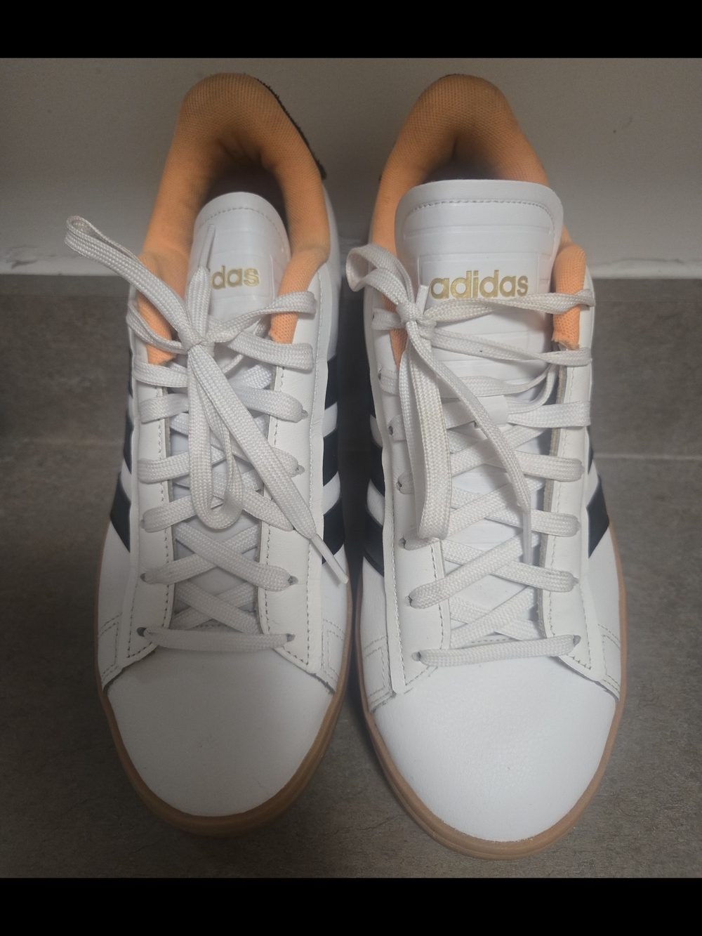 Adidas Women’s White Sneakers with Black Stripes and Peach Lining